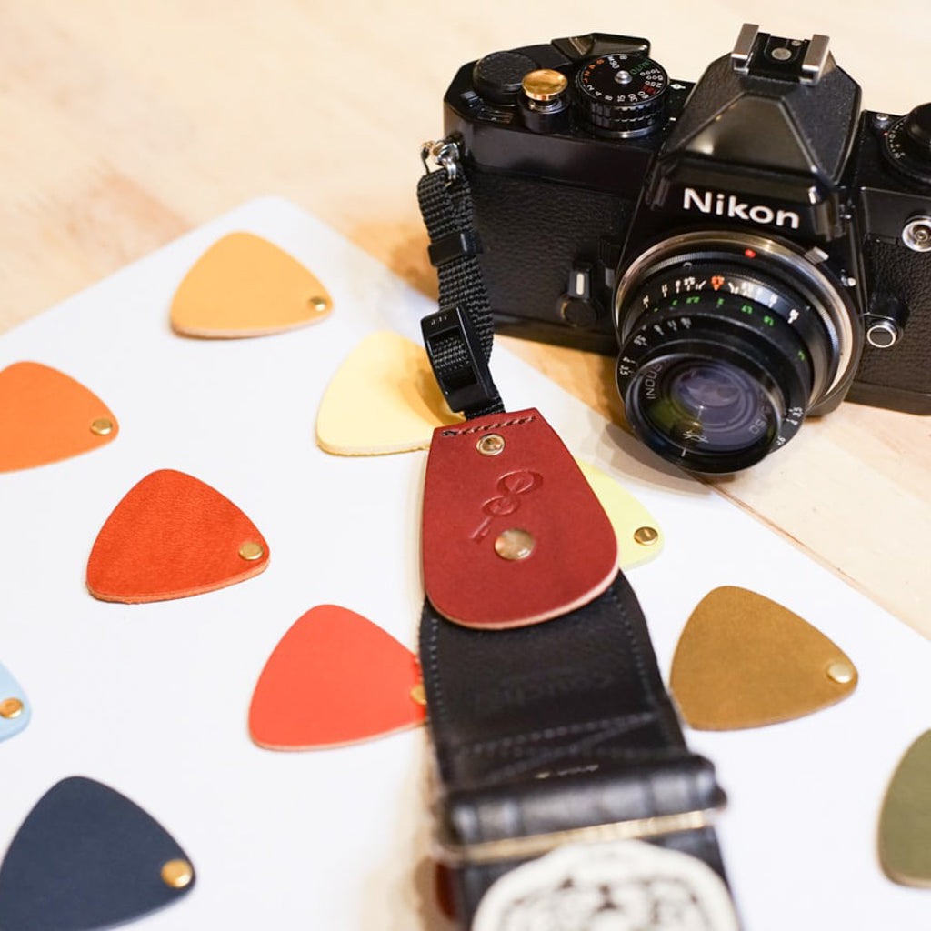 Backstage for Camera | An attachment that turns a guitar strap into a camera strap